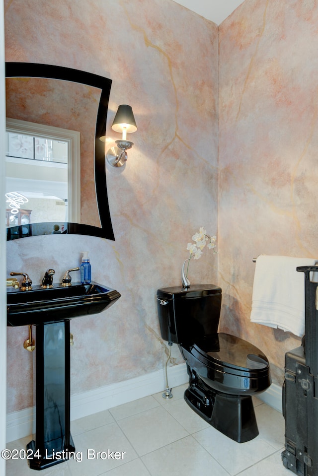 bathroom featuring tile patterned flooring and toilet