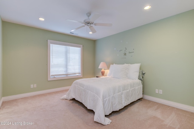 carpeted bedroom with ceiling fan