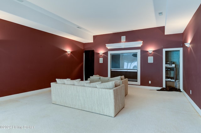 home theater room featuring light carpet