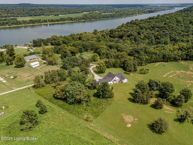 birds eye view of property featuring a forest view, a rural view, and a water view