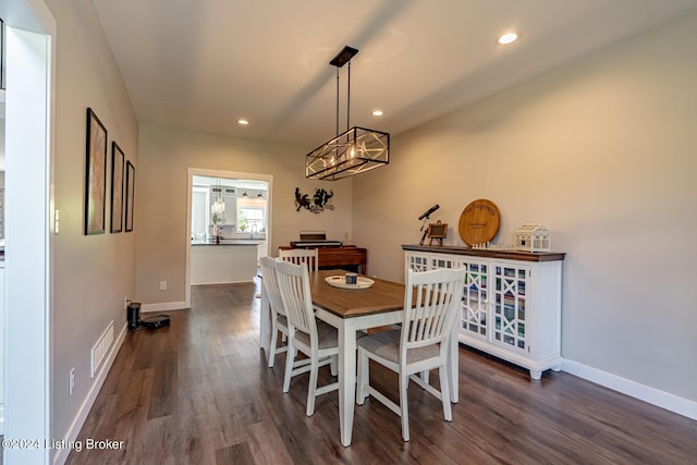 dining room featuring baseboards, visible vents, dark wood finished floors, and recessed lighting