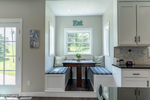 dining area with baseboards, breakfast area, recessed lighting, and a healthy amount of sunlight