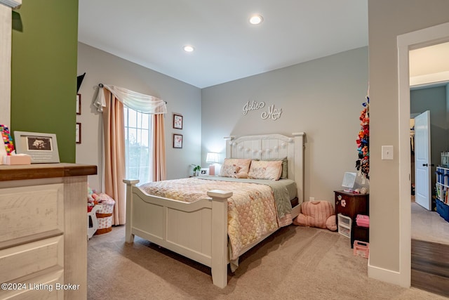 bedroom with recessed lighting, baseboards, and light colored carpet