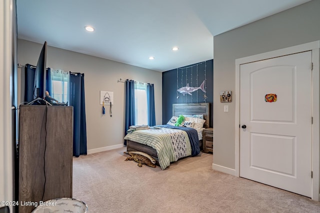 bedroom featuring baseboards, recessed lighting, and light colored carpet