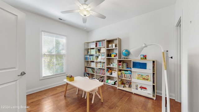 playroom featuring hardwood / wood-style flooring and ceiling fan