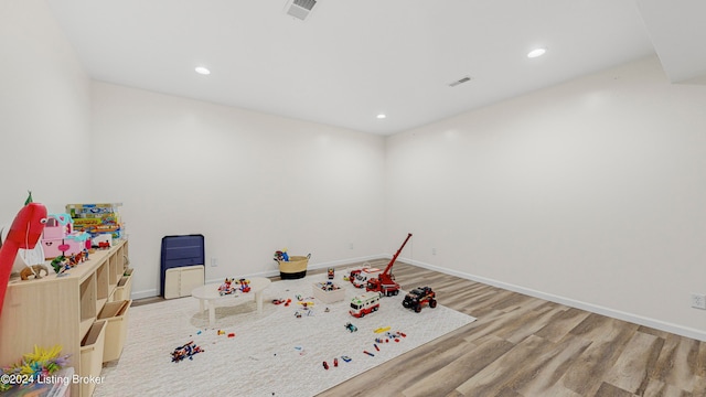 rec room with wood-type flooring