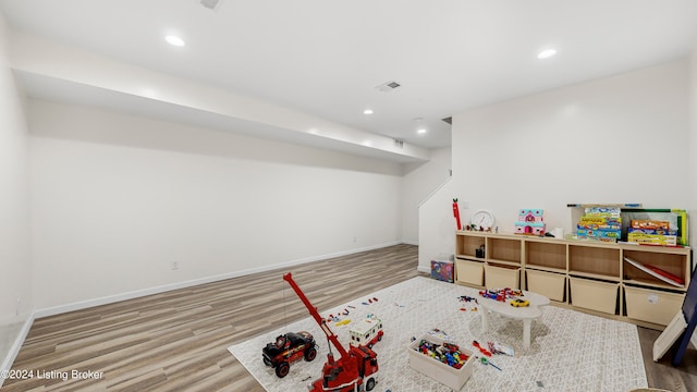 rec room with hardwood / wood-style floors