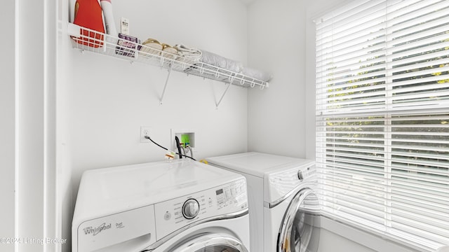 laundry area with separate washer and dryer