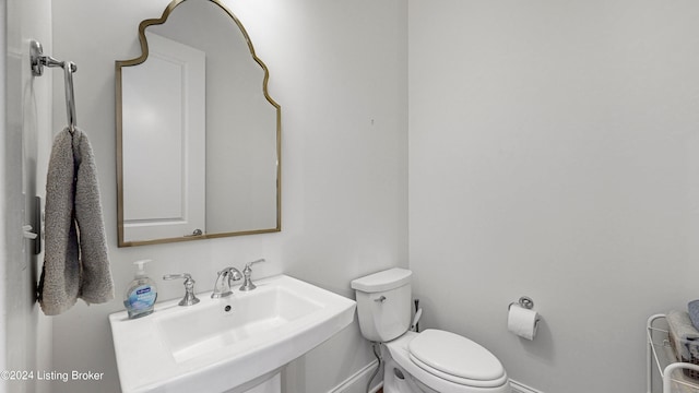 bathroom with toilet and sink