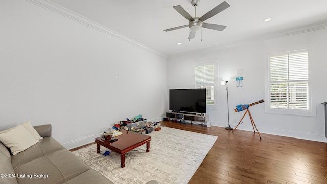 living room featuring crown molding, dark hardwood / wood-style flooring, and ceiling fan