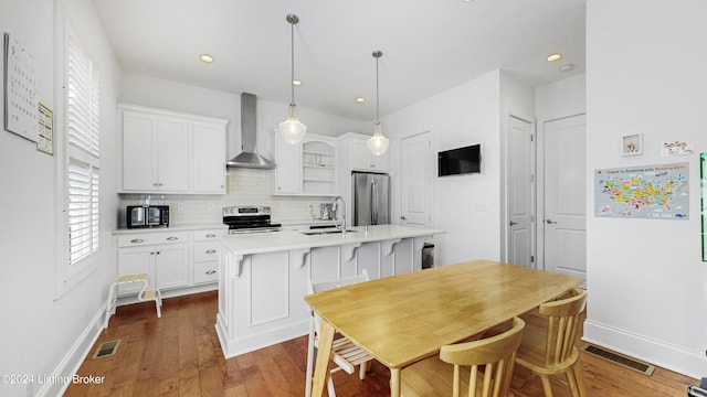 dining area featuring dark wood-type flooring and sink