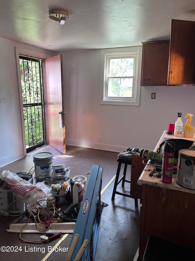 dining area featuring concrete flooring