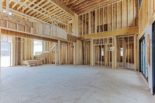 miscellaneous room with a towering ceiling