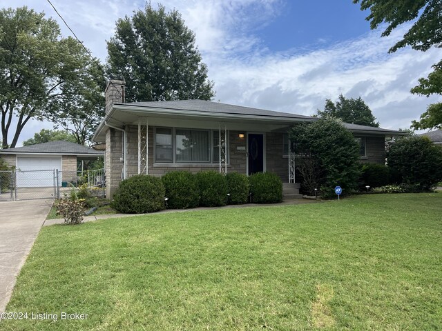 view of front of house with a garage and a front yard