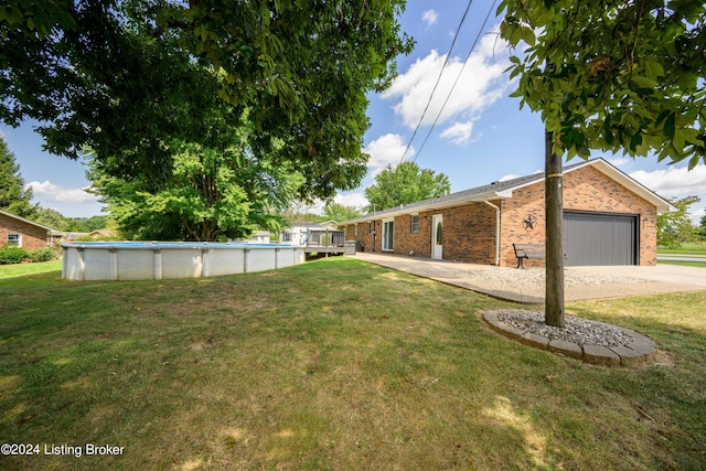 view of front of home with a garage and a front lawn