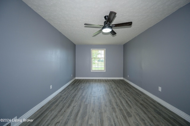 spare room with ceiling fan, a textured ceiling, and wood-type flooring