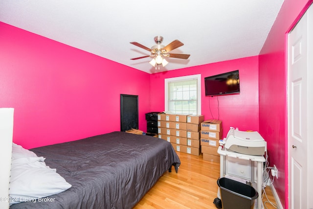 bedroom featuring light wood-type flooring and ceiling fan