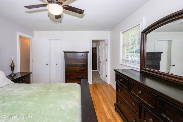 bedroom featuring ceiling fan and light hardwood / wood-style floors