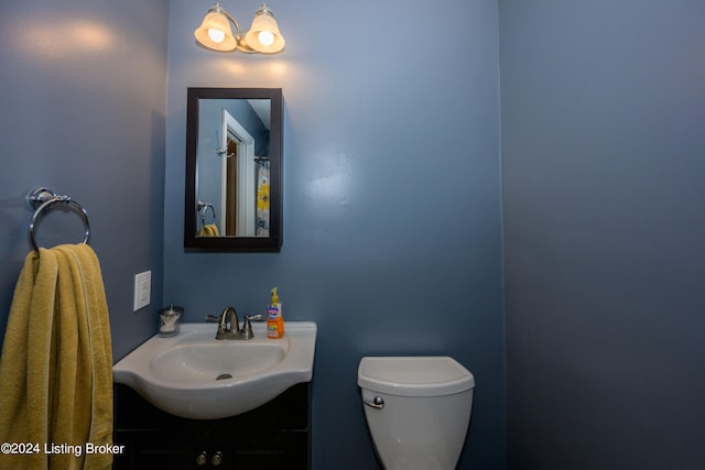 bathroom with toilet and vanity