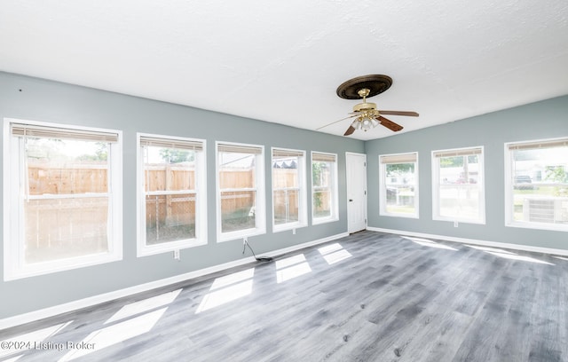 spare room featuring ceiling fan and hardwood / wood-style flooring