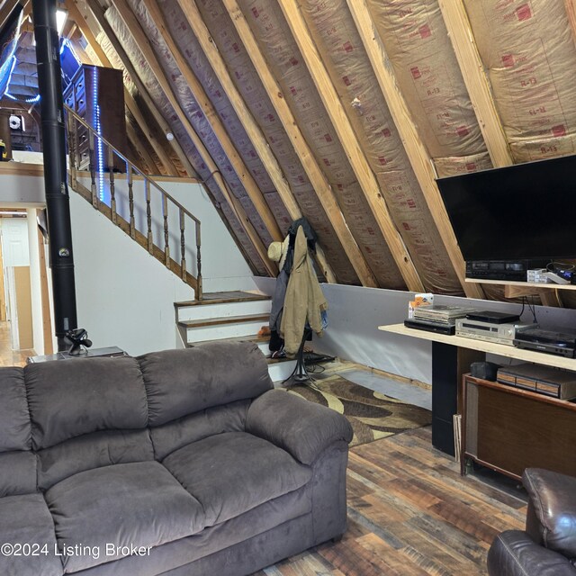 living room with lofted ceiling and hardwood / wood-style floors