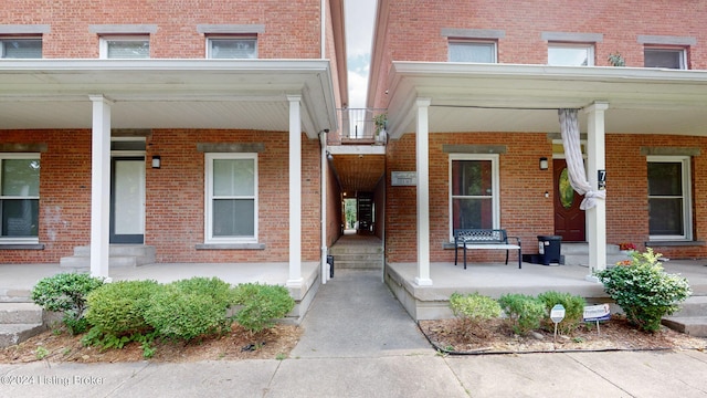 view of exterior entry with covered porch