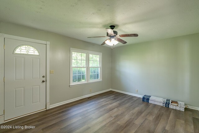 entrance foyer with ceiling fan, hardwood / wood-style floors, and a textured ceiling