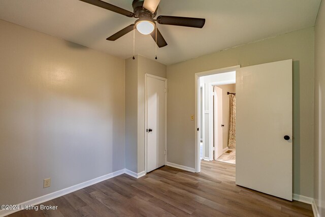 unfurnished bedroom with ceiling fan and light wood-type flooring