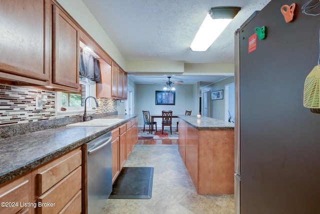 kitchen featuring decorative backsplash, fridge, and light tile patterned floors