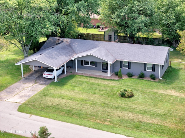 exterior space with a carport and a front lawn