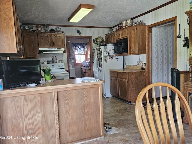 kitchen with white appliances and a textured ceiling