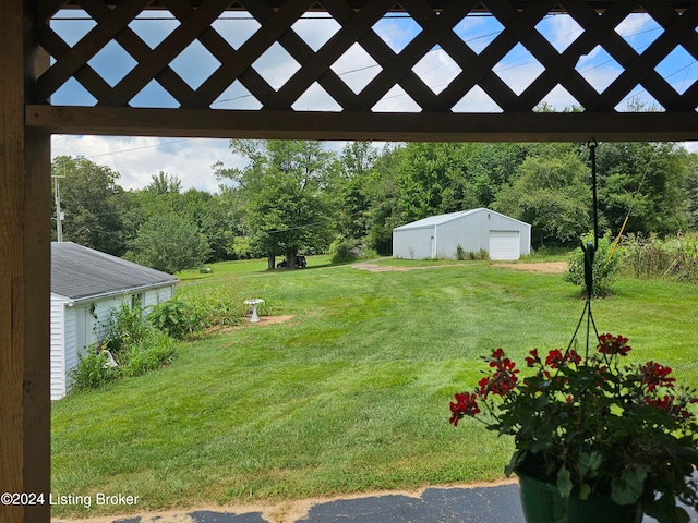 view of yard featuring an outbuilding and a garage