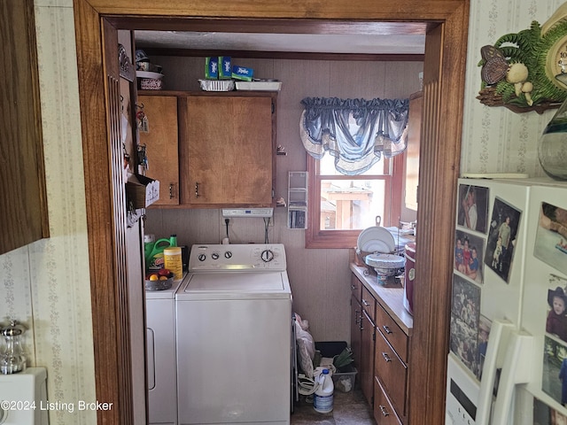 laundry area with independent washer and dryer