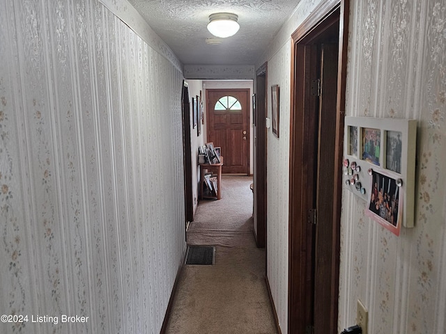 hallway with light colored carpet