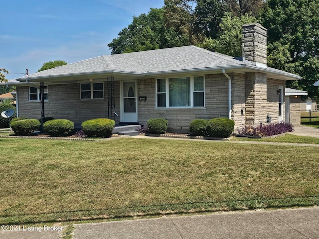 ranch-style house featuring a front yard