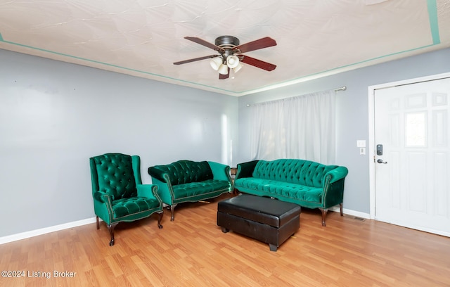 living room with ceiling fan and light hardwood / wood-style floors