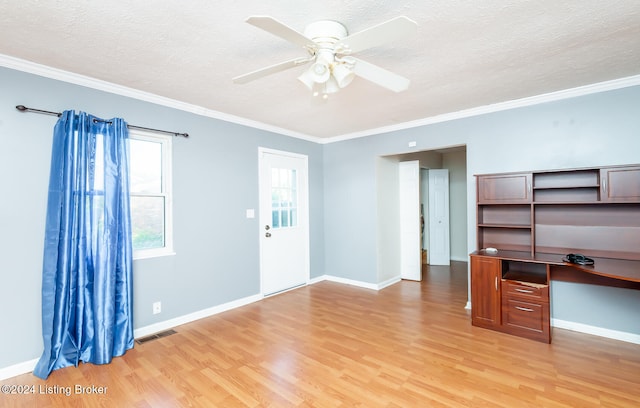 unfurnished living room featuring ceiling fan, a textured ceiling, light hardwood / wood-style flooring, and ornamental molding