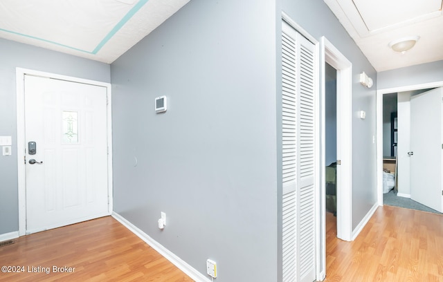 entryway with wood-type flooring