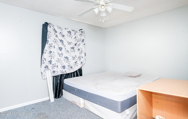 bedroom with ceiling fan and carpet