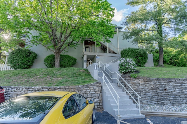 rear view of property with a yard