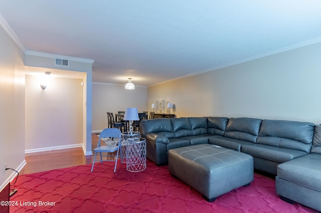 living room featuring crown molding and hardwood / wood-style floors