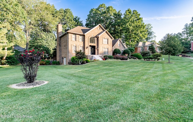 view of front of home featuring a front yard