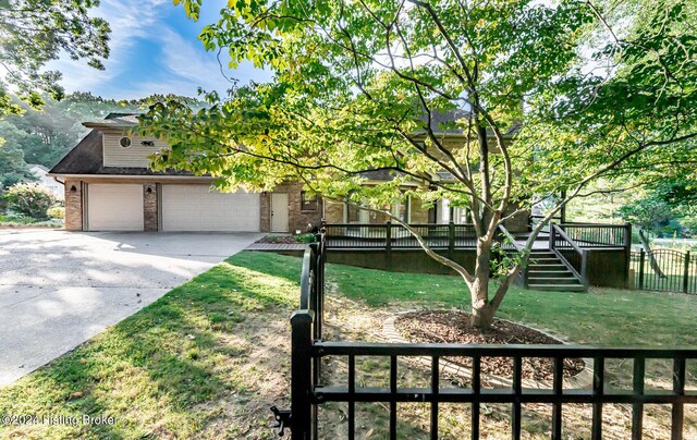 obstructed view of property with a front yard