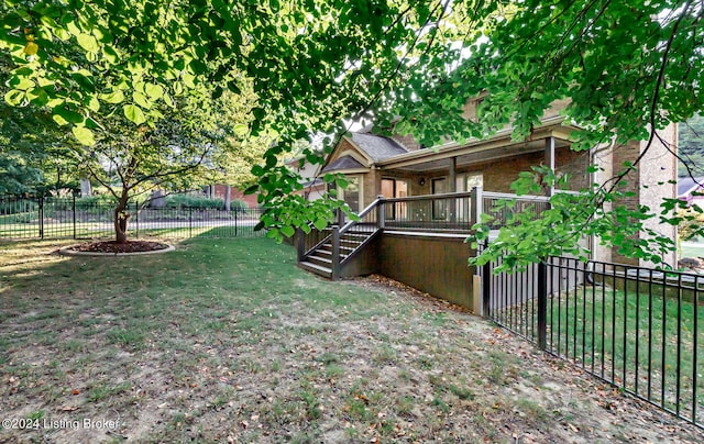 view of yard featuring a wooden deck