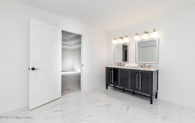 bathroom with vanity and ornamental molding