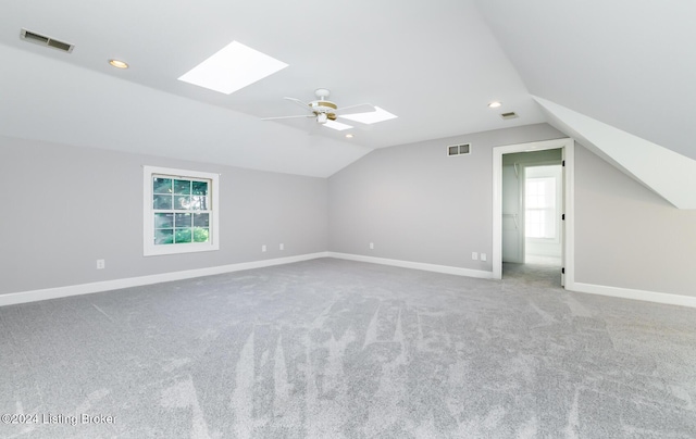 bonus room featuring plenty of natural light, visible vents, and baseboards