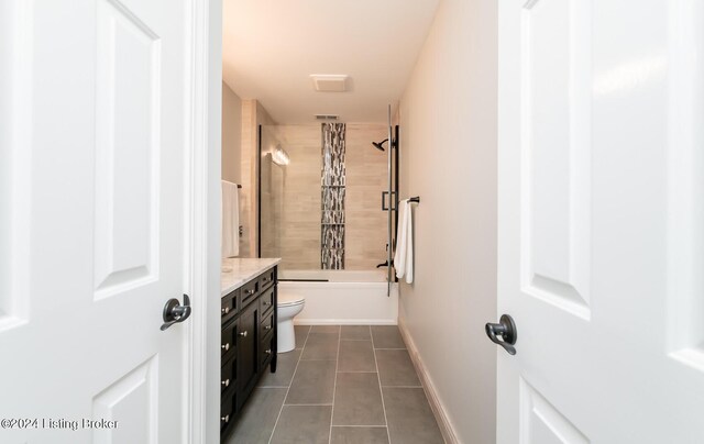 full bathroom with vanity, toilet, tile patterned floors, and tiled shower / bath