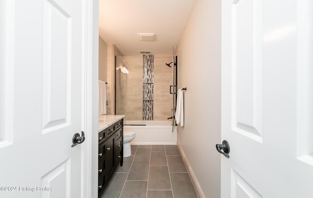 full bathroom with toilet, vanity,  shower combination, baseboards, and tile patterned floors