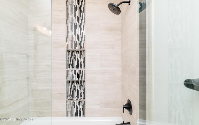 bathroom with a tile shower