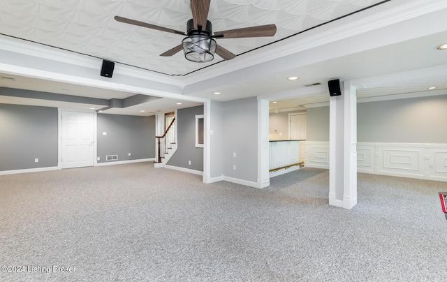 finished basement with visible vents, stairway, ornamental molding, carpet floors, and recessed lighting